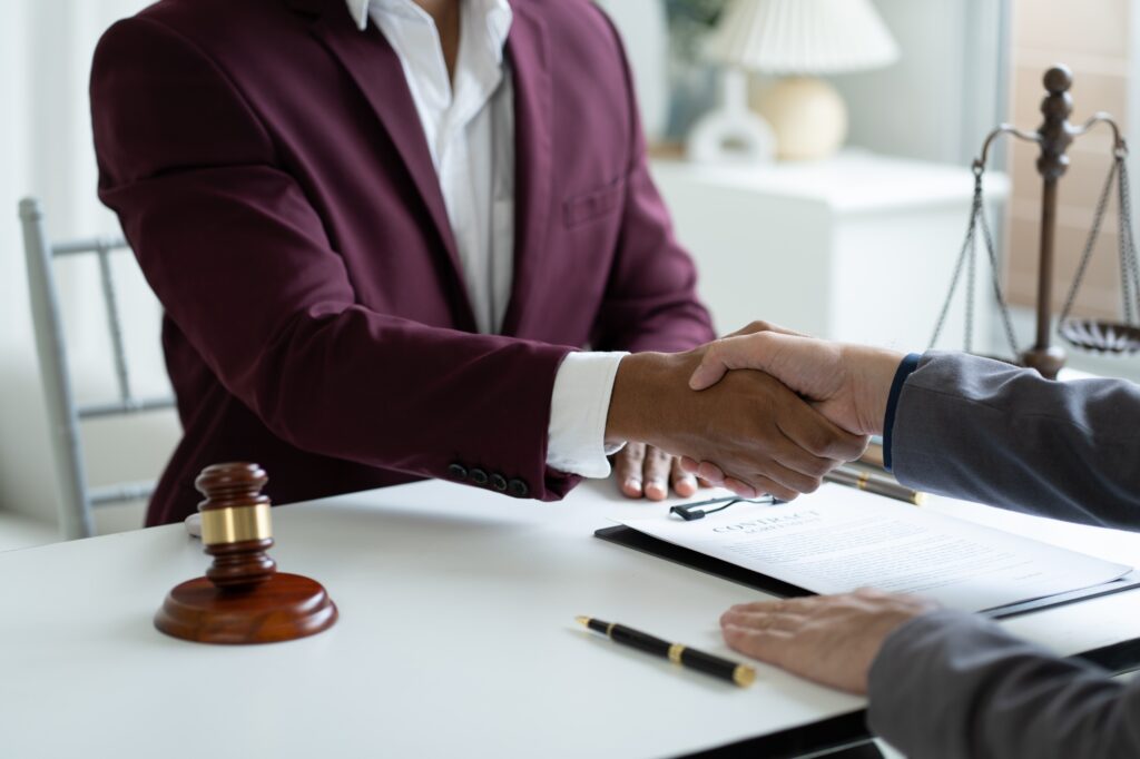 Good service cooperation of Consultation between a male lawyer and his client. law firm concept.